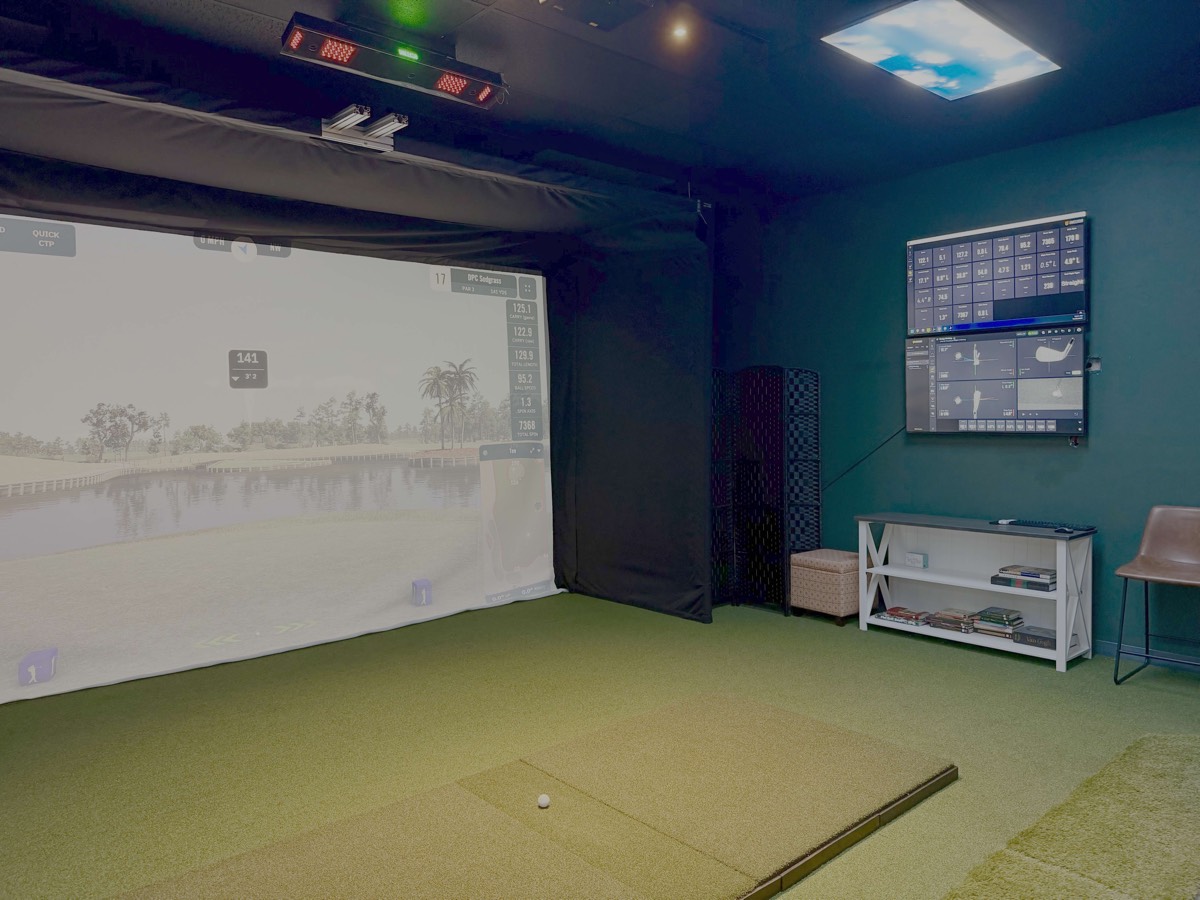 Premium golf simulator bay with ambient lighting